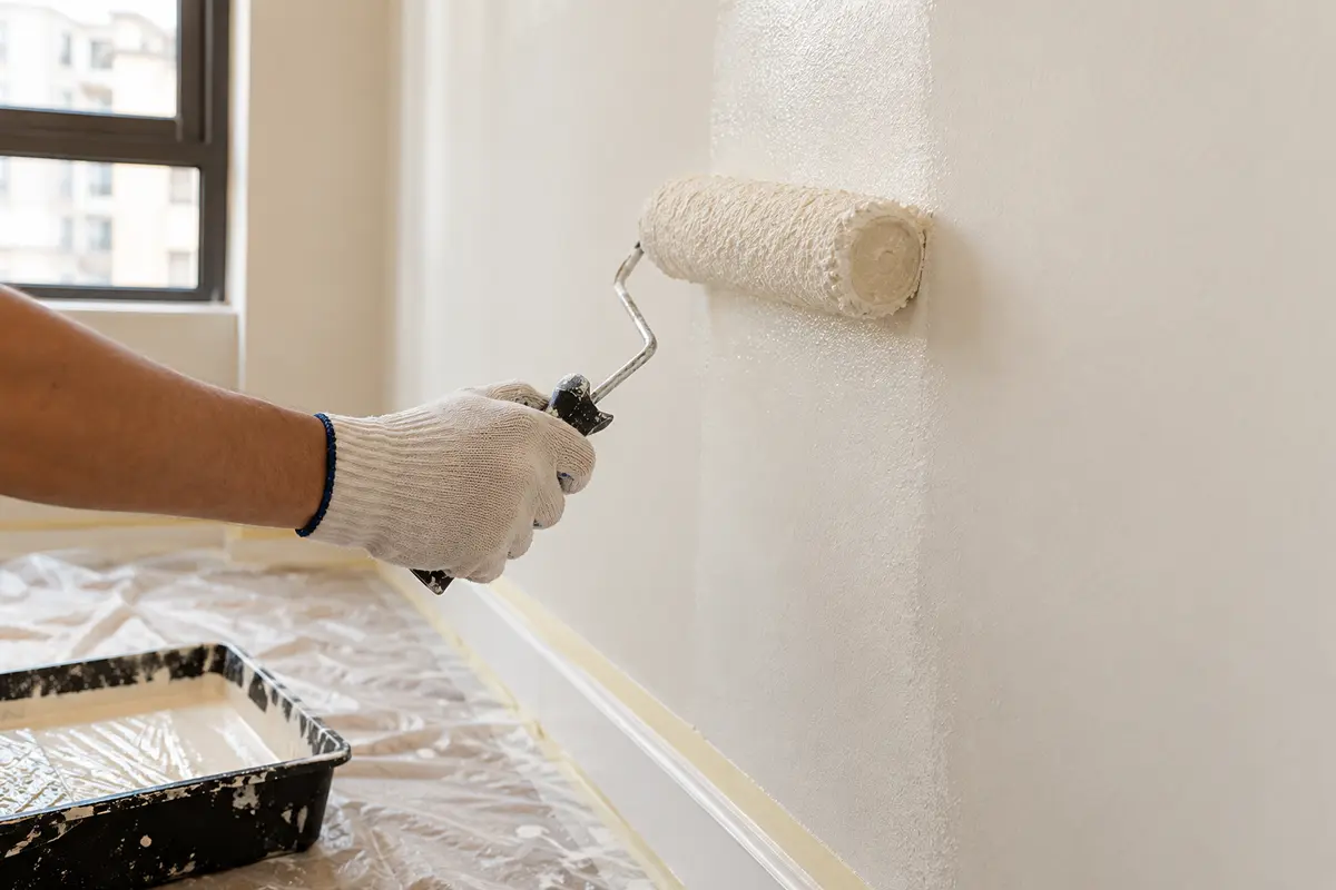 Fresh paint being rolled onto a prepared wall — AI-generated service illustration